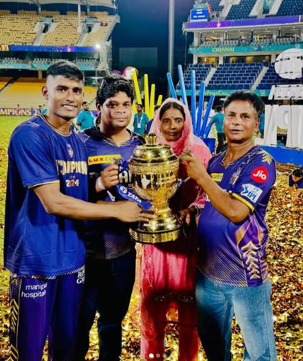 Sakib Hussain and his family standing on a cricket field holding a championship trophy, surrounded by confetti, with stadium seating in the background.
