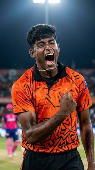 Sunrisers Hyderabad cricketer Sakib Hussain celebrating intensely on the field, shouting with a clenched fist after a key moment during a match.